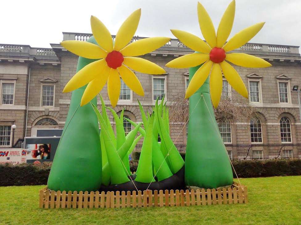 Yellow inflatable flowers and grass